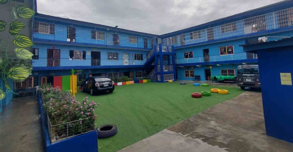 Classroom blocks around the green courtyard, Victoria Children’s School