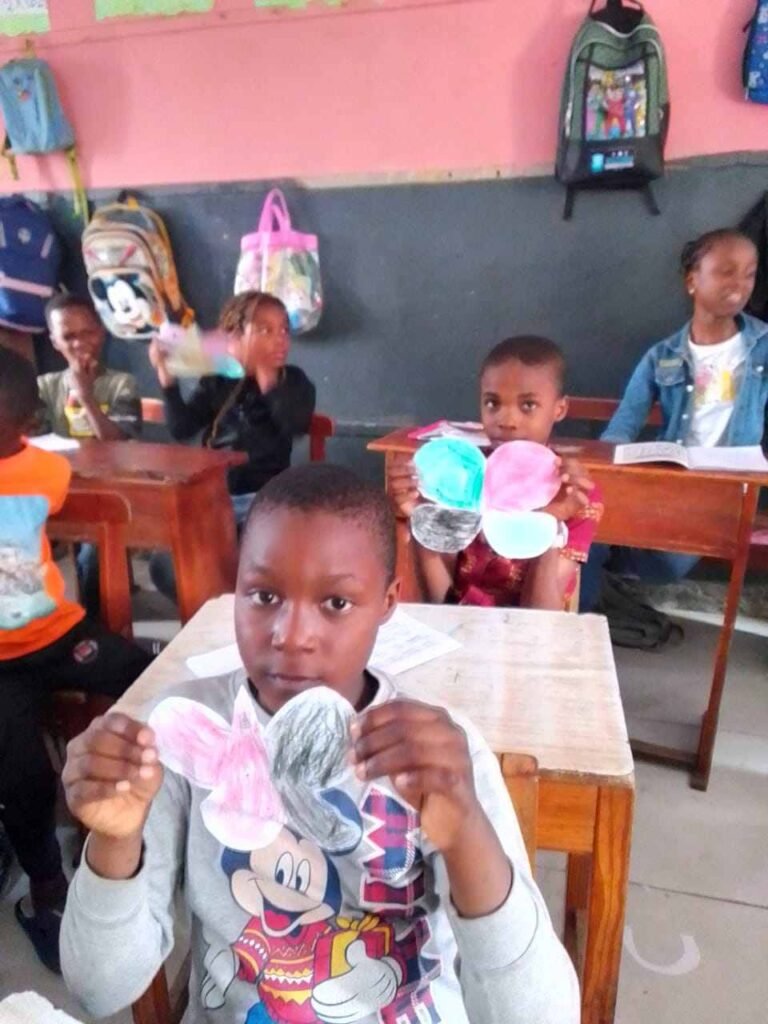 A pupil with her paper butterfly