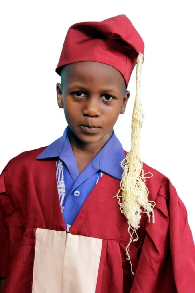 A graduating pupil in cap and gown