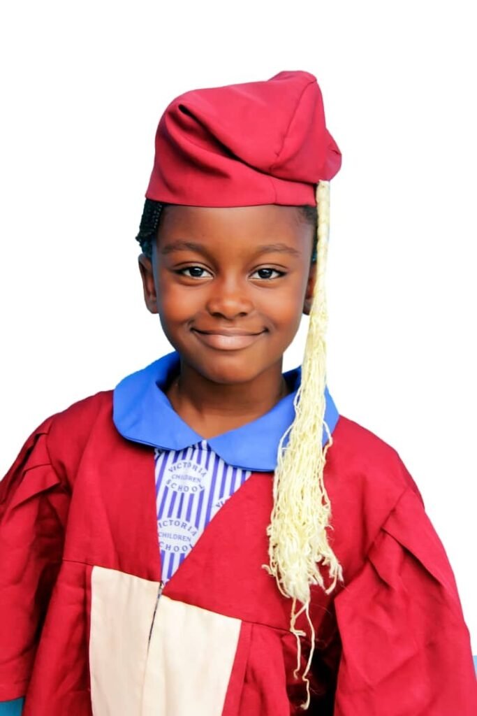 A graduating pupil in cap and gown