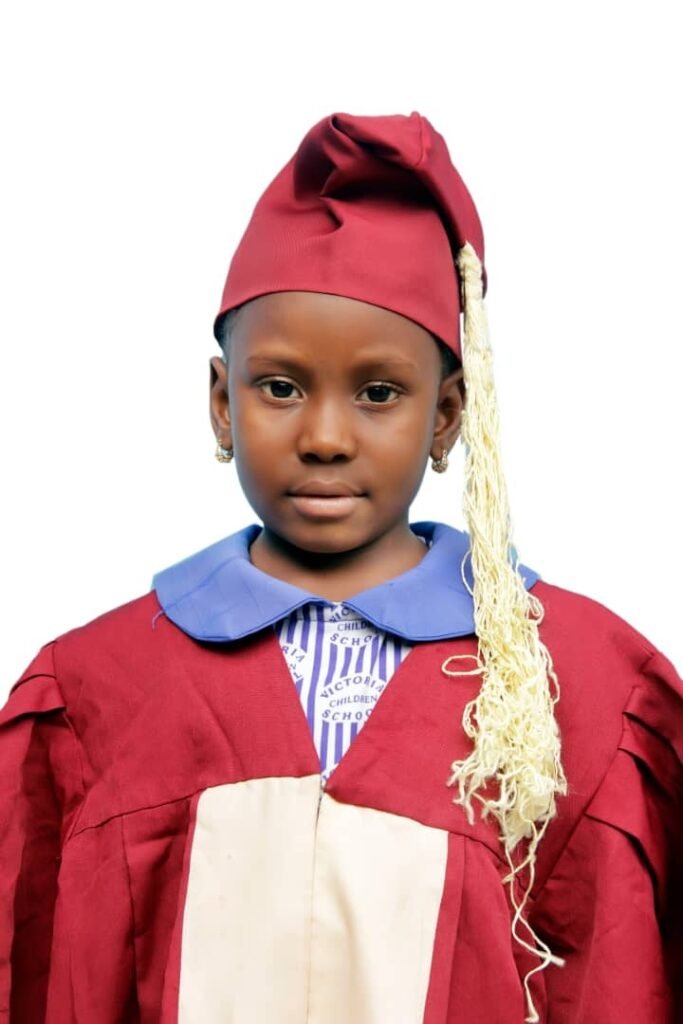 A graduating pupil in cap and gown