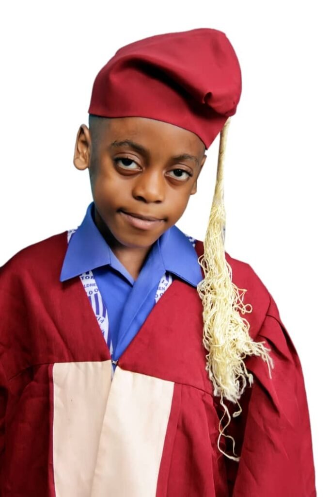 A graduating pupil in cap and gown