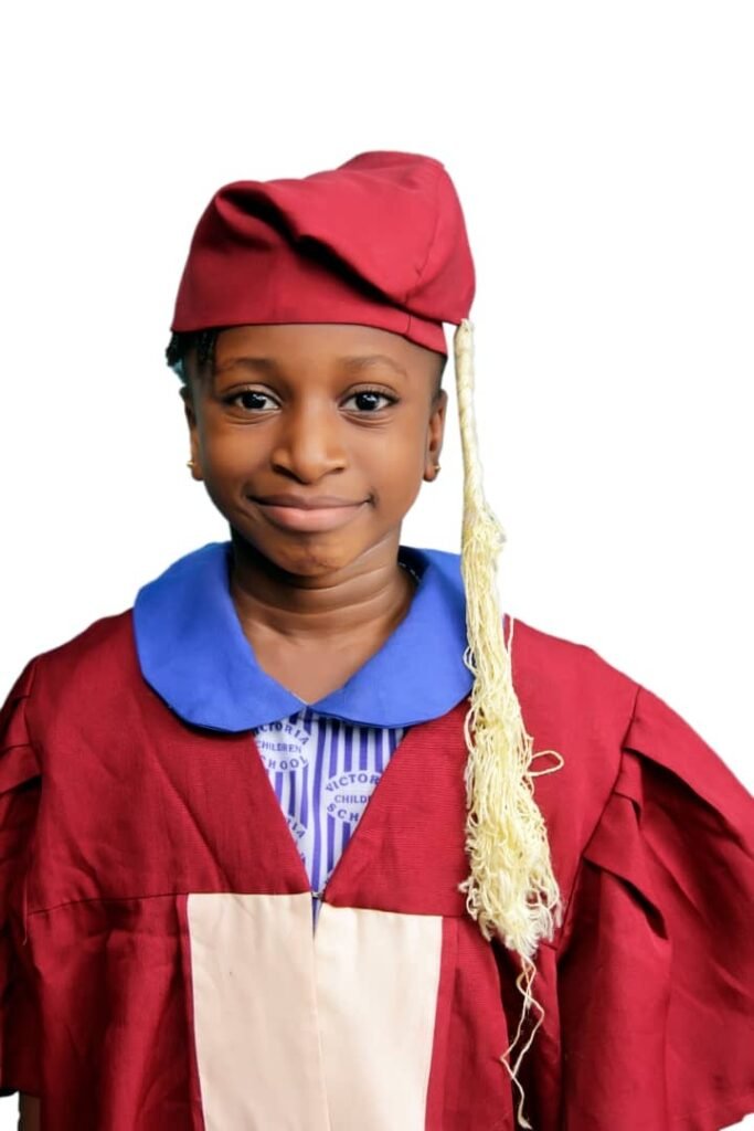 A graduating pupil in cap and gown