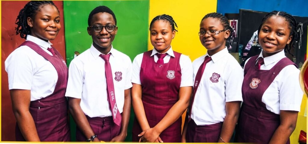 A group of Victoria High School students in their maroon and white uniform