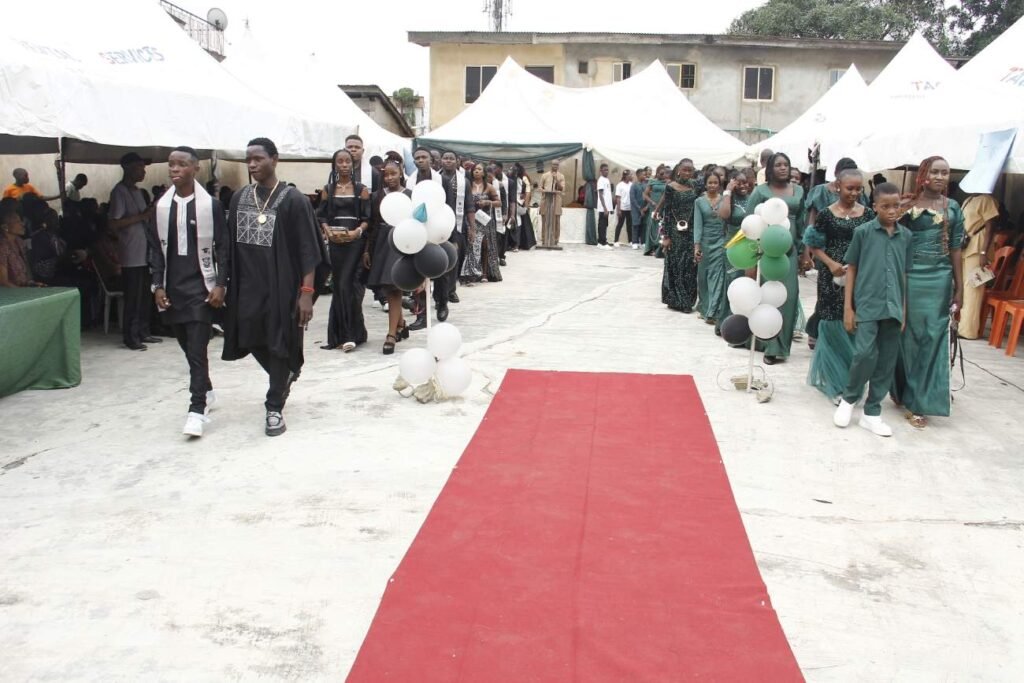 Graduands processing on the red carpet at Victoria High School